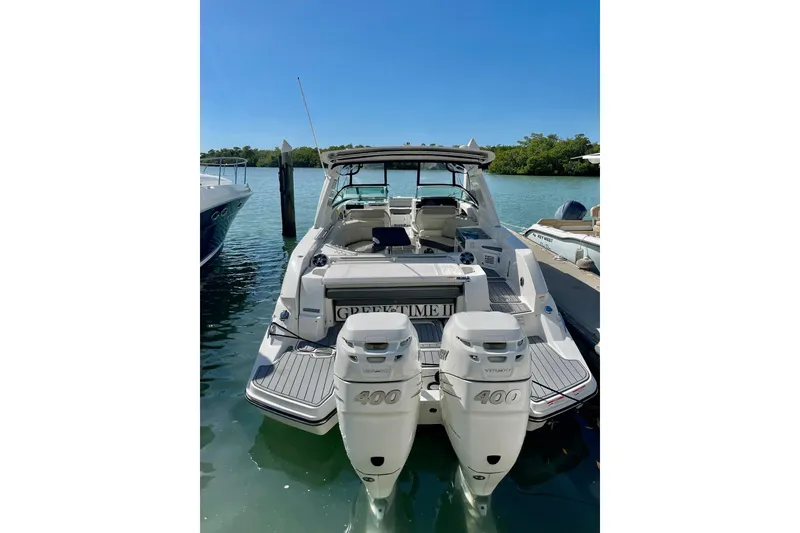 Slide: The Image of 2020 Sea Ray SLX 350 Outboard boat docked on a sunny day. - 37