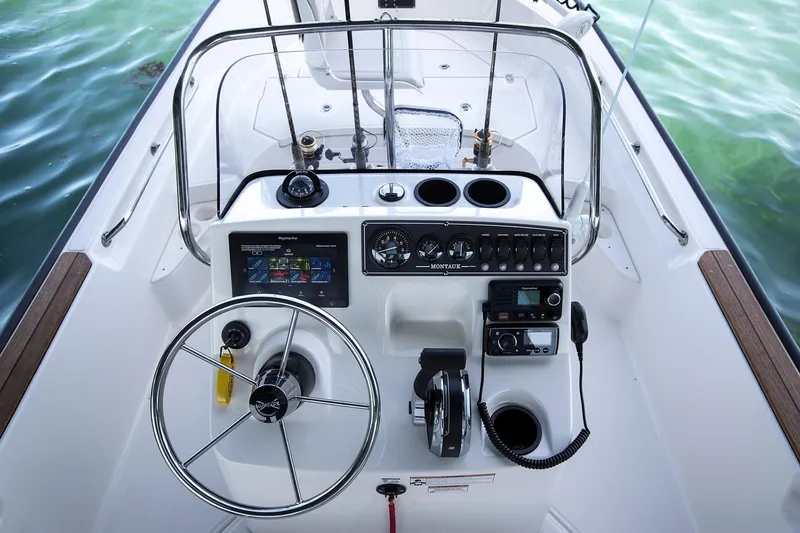 Slide: The Image of 2022 Boston Whaler 170 Montauk dashboard with Garmin GPS and navigation display. - 16