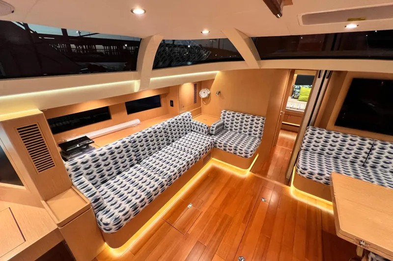 Slide: The Image of Luxurious interior of 2024 Hylas H57 yacht with modern seating and ambient lighting. - 10