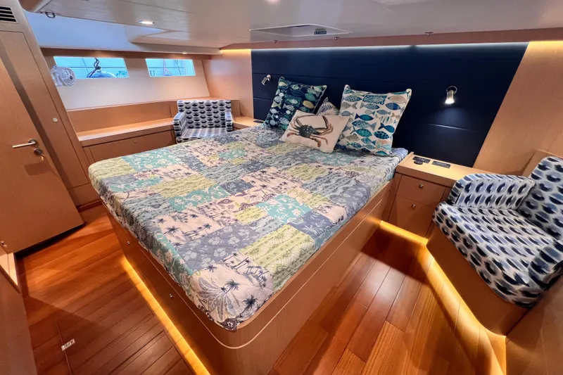 Slide: The Image of Luxurious 2024 Hylas H57 yacht cabin with elegant bedding and ambient lighting. - 101