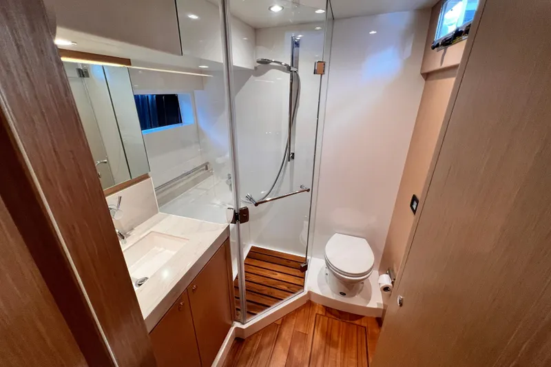Slide: The Image of Luxurious 2024 Hylas H57 yacht bathroom with modern fixtures and wooden flooring. - 103