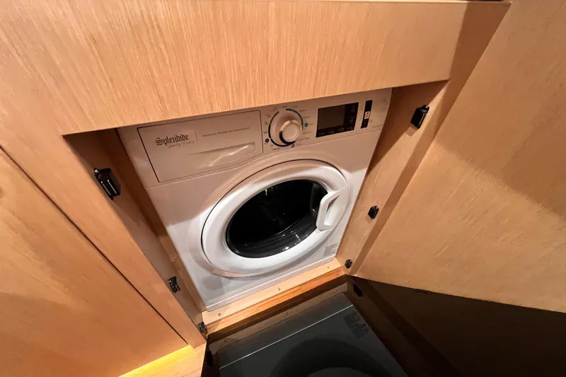 Slide: The Image of Compact washing machine in 2024 Hylas H57 yacht's wooden cabinet. - 105