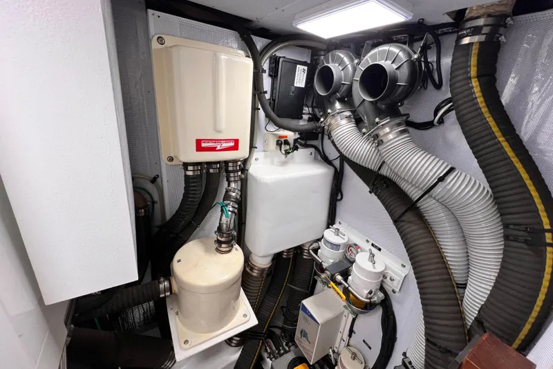 Slide: The Image of Engine room of 2024 Hylas H57 yacht with mechanical components and ventilation system. - 106