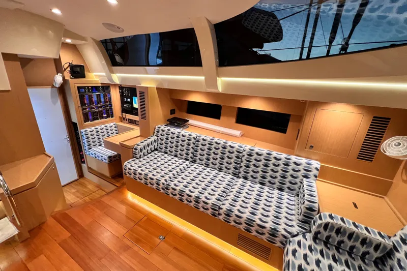 Slide: The Image of Luxurious interior of 2024 Hylas H57 yacht with modern seating and control panel. - 11