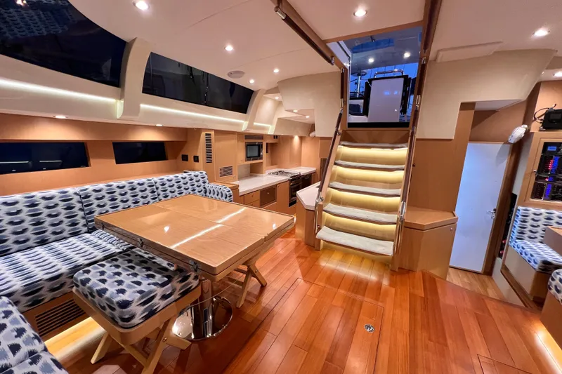 Slide: The Image of Luxurious interior of 2024 Hylas H57 yacht with elegant wood flooring and modern seating. - 13