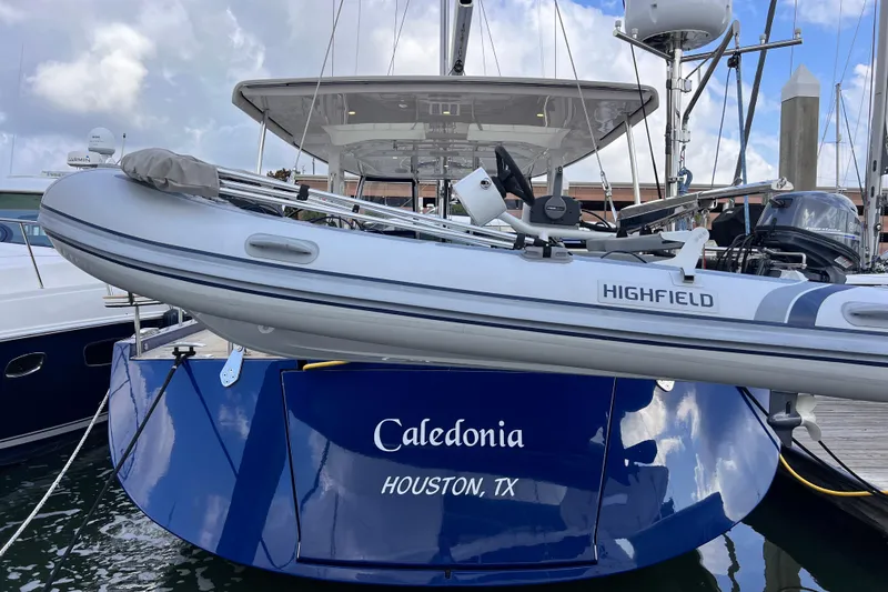 Slide: The Image of 2024 Hylas H57 yacht "Caledonia" docked with Highfield tender, Houston, TX. - 2