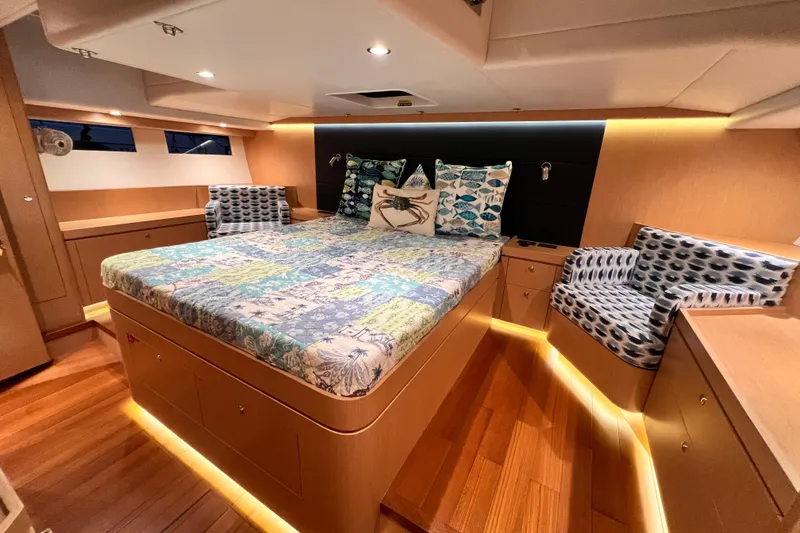 Slide: The Image of Luxurious 2024 Hylas H57 yacht cabin with elegant bedding and ambient lighting. - 20