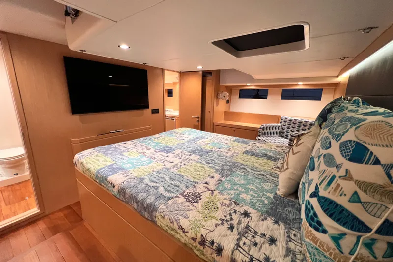 Slide: The Image of Luxurious 2024 Hylas H57 yacht bedroom with modern decor and ensuite bathroom. - 22