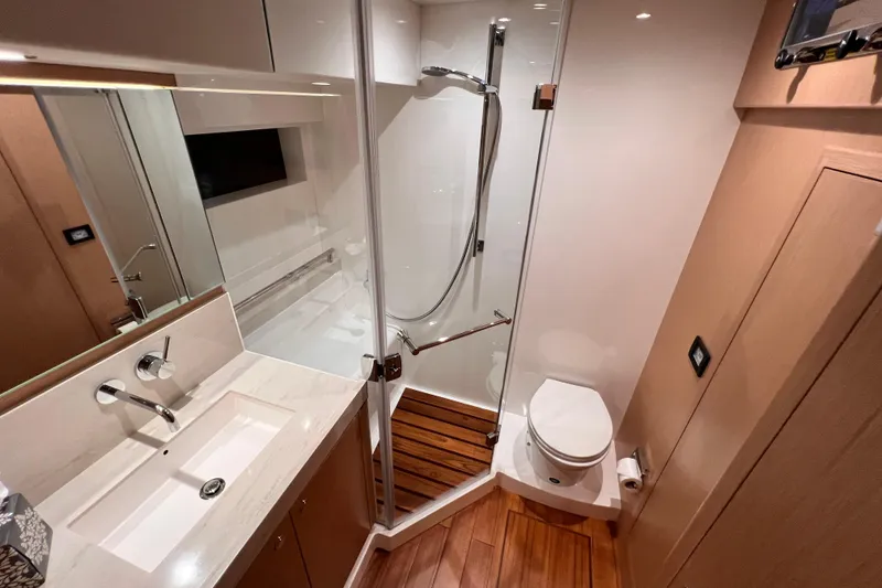 Slide: The Image of Luxurious bathroom in 2024 Hylas H57 yacht with modern fixtures and wooden flooring. - 23