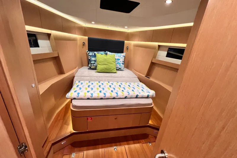 Slide: The Image of Luxurious 2024 Hylas H57 yacht cabin with modern wood finish and cozy bedding. - 28