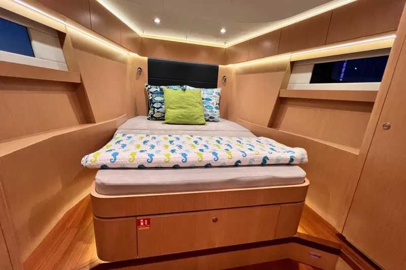Slide: The Image of Luxurious 2024 Hylas H57 yacht cabin with cozy bed and modern wood finish. - 29