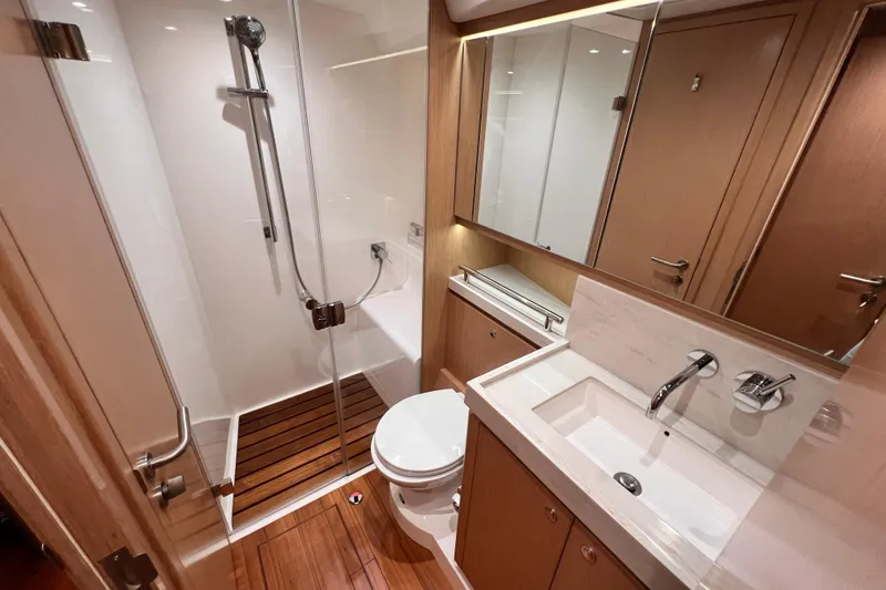 Slide: The Image of Luxurious bathroom in 2024 Hylas H57 yacht with modern fixtures and wooden accents. - 30