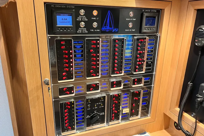 Slide: The Image of Electrical control panel of 2024 Hylas H57 yacht, featuring switches and displays. - 36