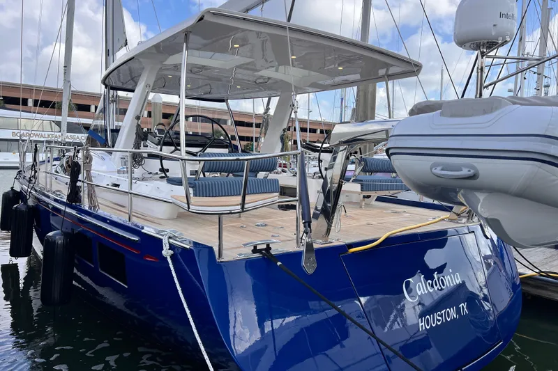 Slide: The Image of 2024 Hylas H57 yacht docked, featuring sleek design and spacious deck in Houston, Texas marina. - 47