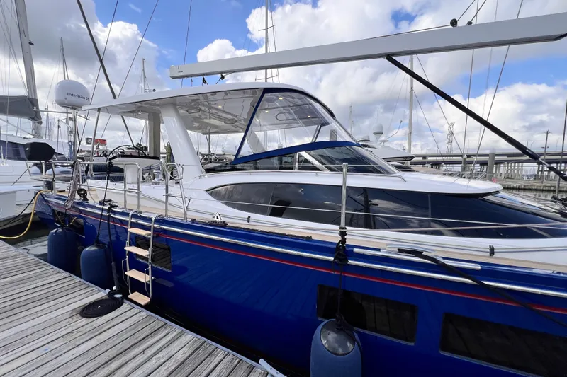 Slide: The Image of 2024 Hylas H57 yacht docked at marina under cloudy sky. - 51