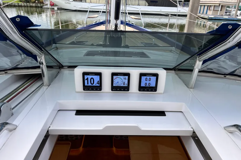 Slide: The Image of 2024 Hylas H57 yacht cockpit with digital navigation displays and sleek design. - 63