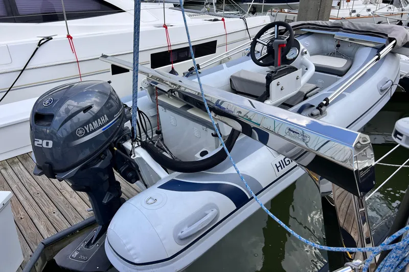 Slide: The Image of Inflatable boat with Yamaha 20 engine, docked beside a 2024 Hylas H57 yacht. - 64