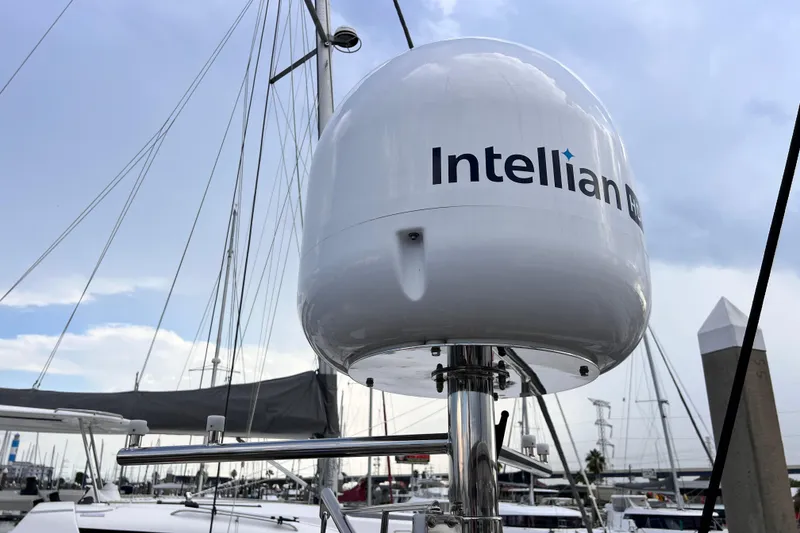 Slide: The Image of Satellite equipment on 2024 Hylas H57 yacht, featuring Intellian technology at marina. - 65