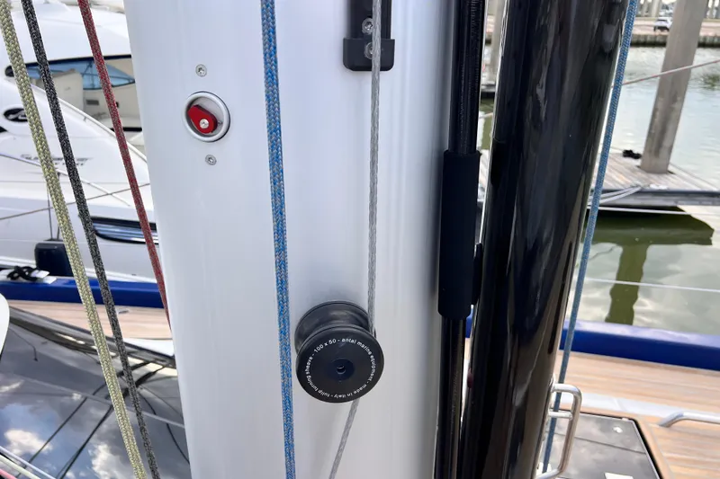 Slide: The Image of Close-up of 2024 Hylas H57 sailboat mast with ropes and fittings. - 72