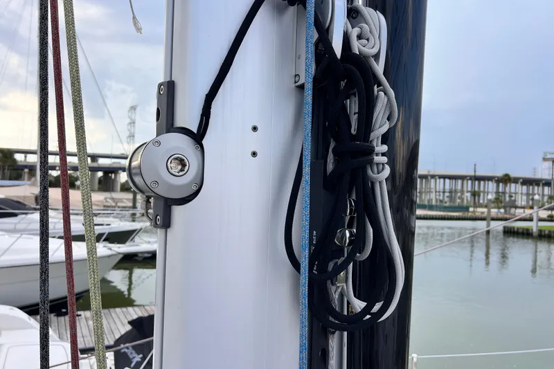 Slide: The Image of Close-up of 2024 Hylas H57 sailboat mast with ropes and pulleys. - 73