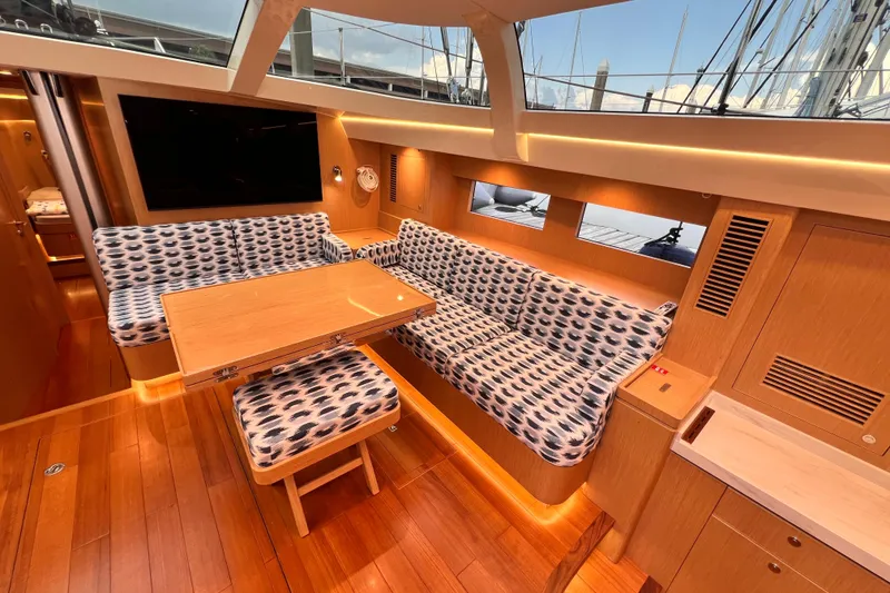 Slide: The Image of Luxurious interior of 2024 Hylas H57 yacht with stylish seating and wooden finishes. - 82