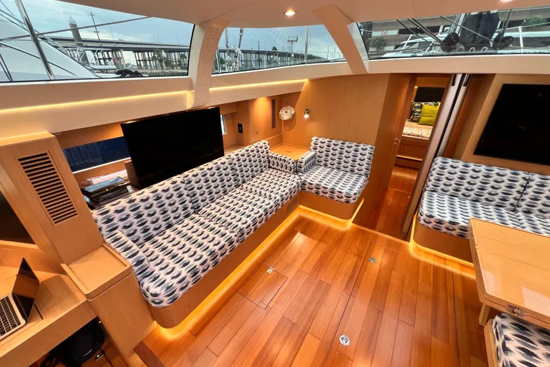 Slide: The Image of Luxurious interior of 2024 Hylas H57 yacht with modern seating and wooden flooring. - 83