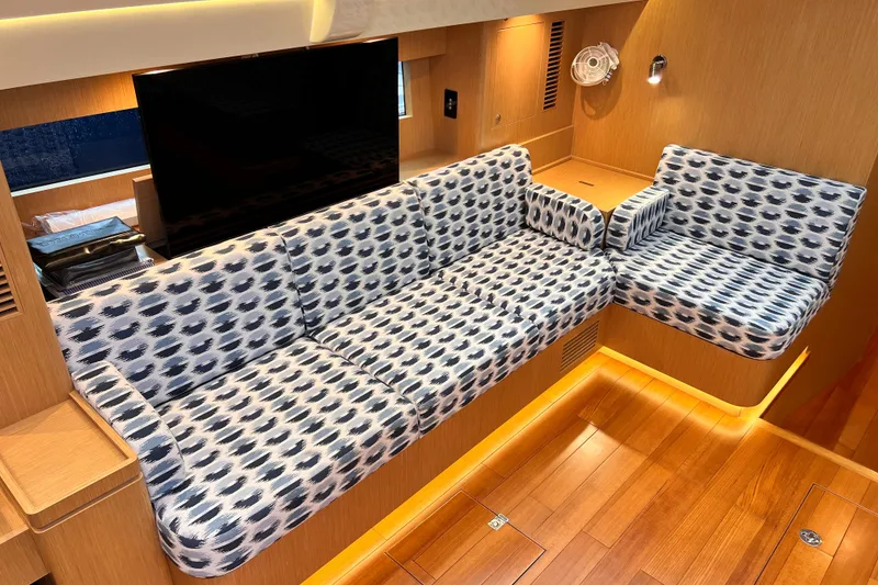 Slide: The Image of Luxurious interior of 2024 Hylas H57 yacht with patterned seating and wooden flooring. - 84