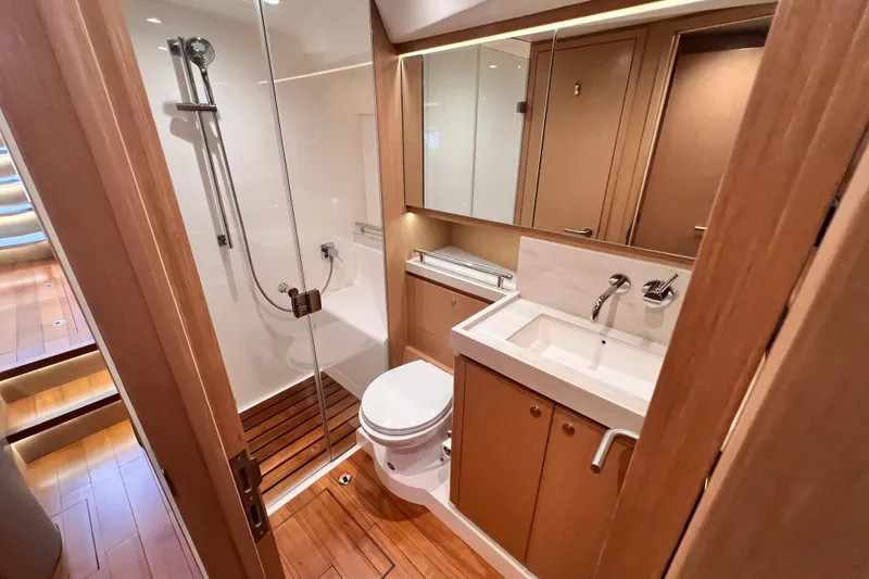 Slide: The Image of Luxurious bathroom in 2024 Hylas H57 yacht with modern fixtures and wooden accents. - 89