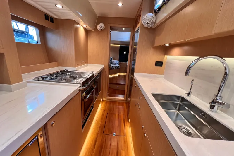 Slide: The Image of Luxurious 2024 Hylas H57 yacht kitchen with modern appliances and sleek design. - 93
