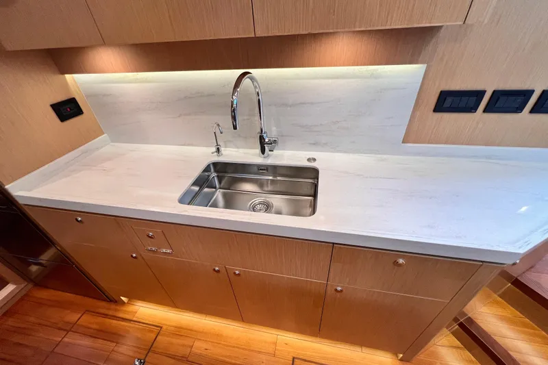 Slide: The Image of Modern kitchen sink in 2024 Hylas H57 yacht with sleek countertop design. - 94