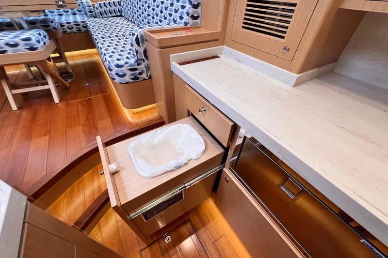Slide: The Image of 2024 Hylas H57 yacht interior with modern kitchen and seating area. - 96