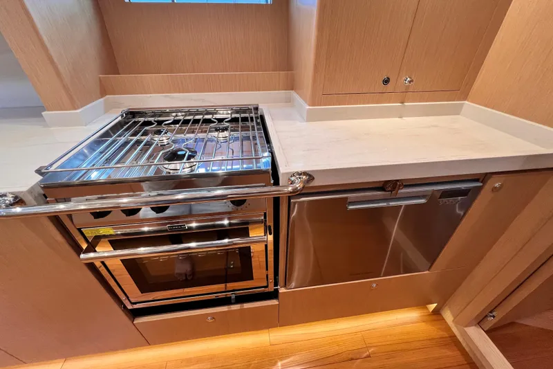 Slide: The Image of 2024 Hylas H57 yacht kitchen with modern stove and sleek cabinetry. - 97