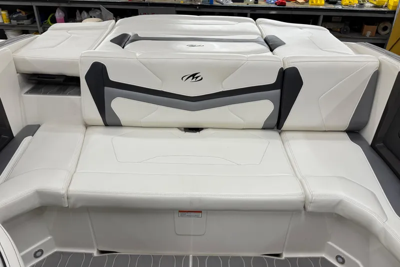 Slide: The Image of 2014 Monterey 214SS Super Sport boat interior with white and gray seating. - 10