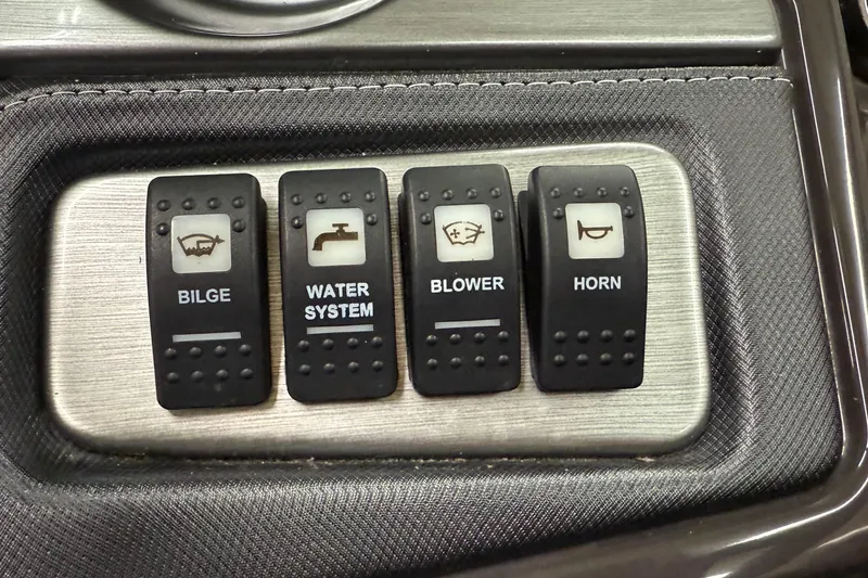 Slide: The Image of Control panel of a 2014 Monterey 214SS Super Sport boat with bilge, water, blower, horn switches. - 13
