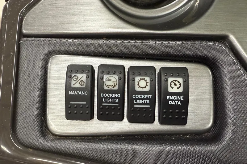 Slide: The Image of Control panel of a 2014 Monterey 214SS Super Sport boat with labeled switches. - 14