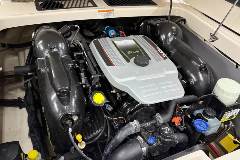 Slide: The Image of Engine compartment of a 2014 Monterey 214SS Super Sport boat, featuring a MerCruiser engine. - 16