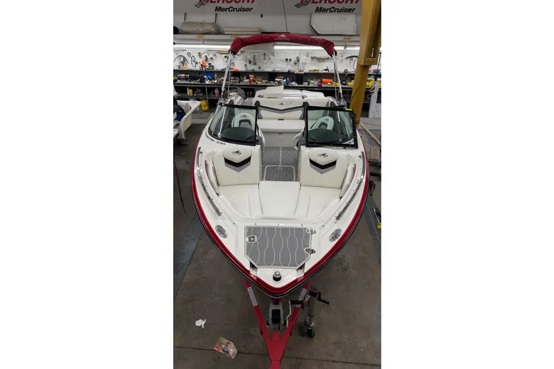 Slide: The Image of 2014 Monterey 214SS Super Sport boat in workshop, red and white design. - 4