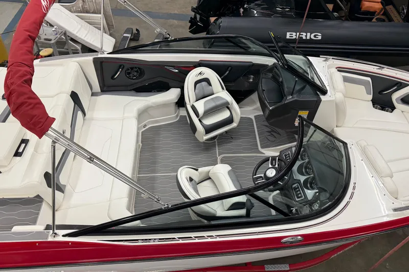 Slide: The Image of 2014 Monterey 214SS Super Sport boat interior with white seating and red accents. - 6