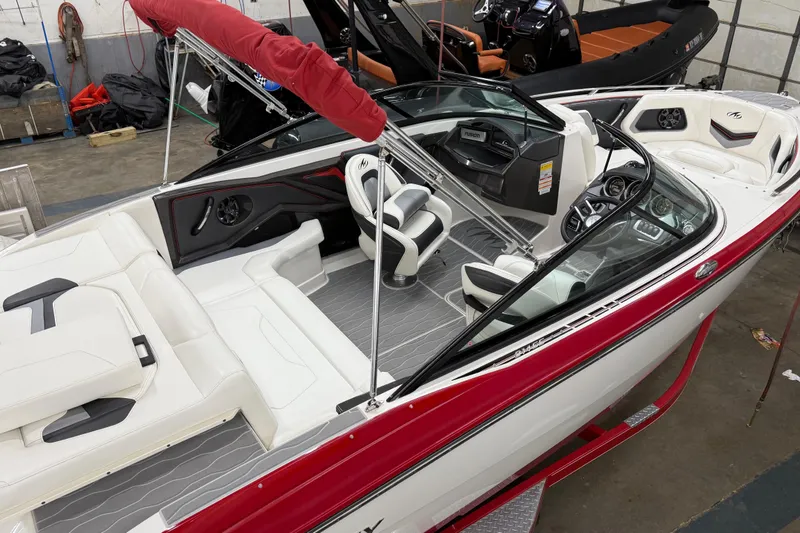 Slide: The Image of 2014 Monterey 214SS Super Sport boat with red accents and sleek interior design. - 7