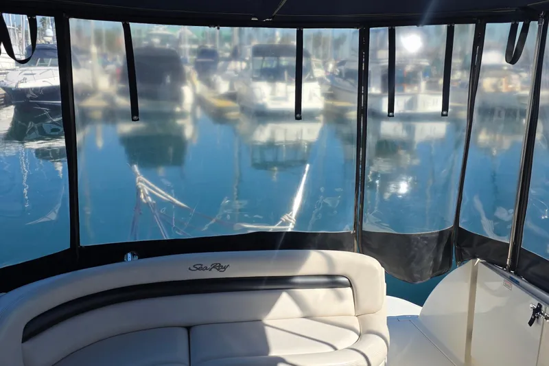 Slide: The Image of 2005 Sea Ray 340 Sundancer interior with marina view through clear panels. - 11