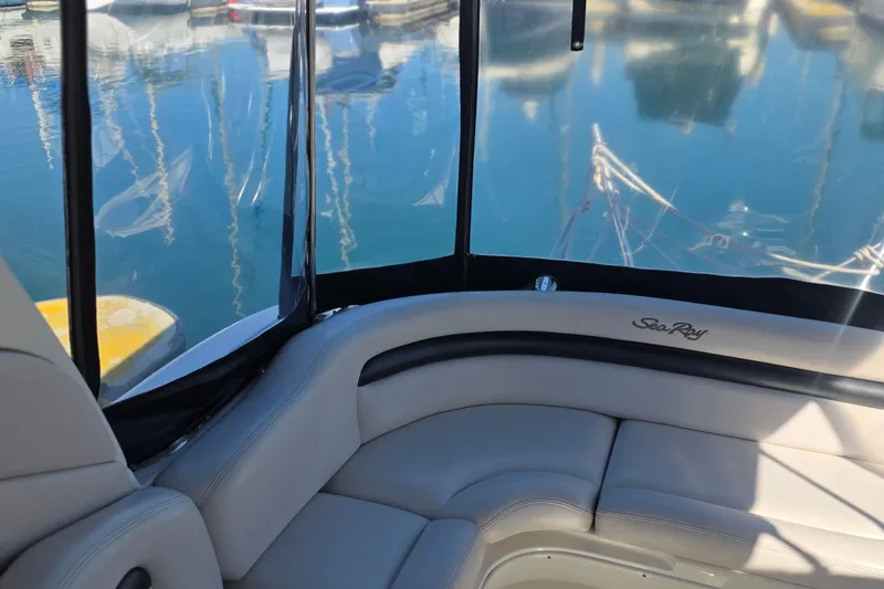 Slide: The Image of Interior view of 2005 Sea Ray 340 Sundancer boat with marina backdrop. - 12