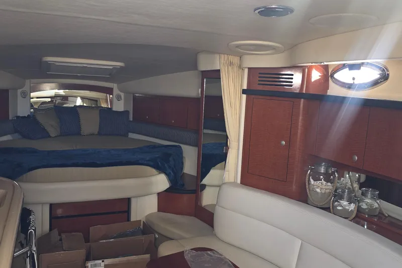 Slide: The Image of Interior of 2005 Sea Ray 340 Sundancer yacht with cozy seating and elegant wood cabinetry. - 21