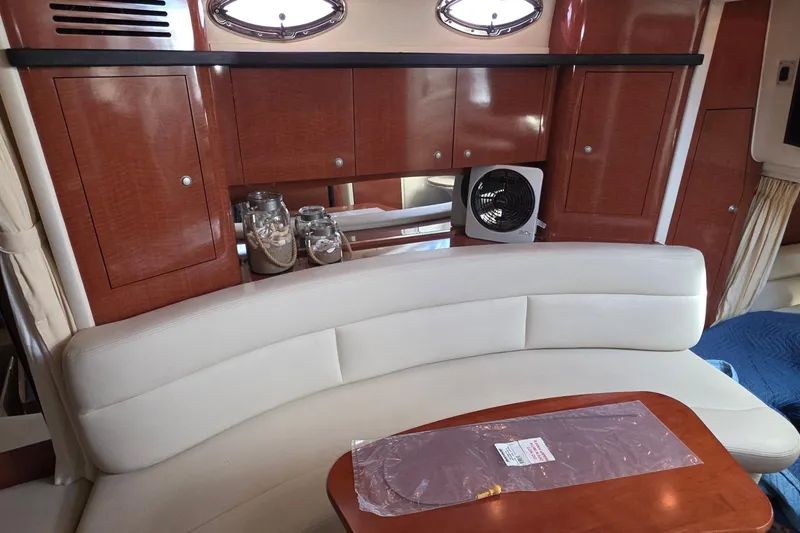 Slide: The Image of Interior of 2005 Sea Ray 340 Sundancer with elegant seating and wooden cabinetry. - 26