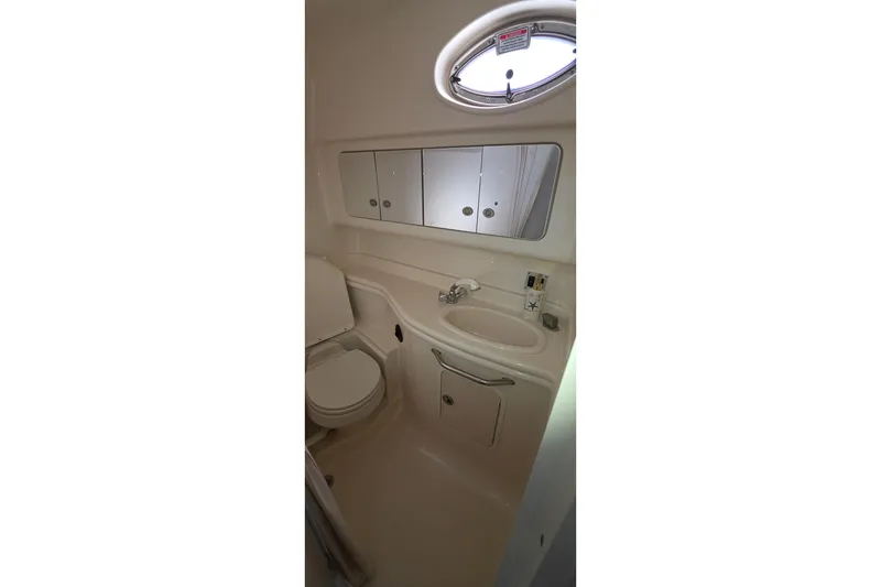 Slide: The Image of Bathroom interior of 2005 Sea Ray 340 Sundancer yacht, featuring sink and toilet. - 31