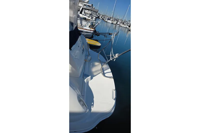 Slide: The Image of 2005 Sea Ray 340 Sundancer docked at marina, calm water reflection. - 4