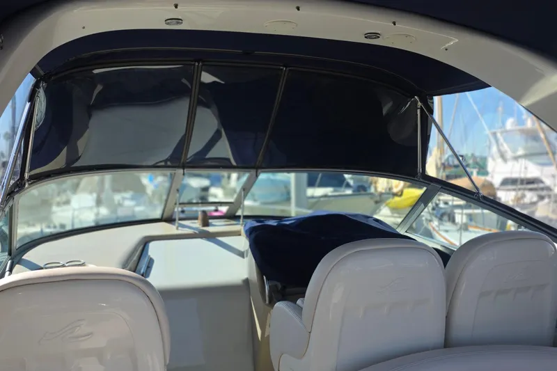 Slide: The Image of Interior view of a 2005 Sea Ray 340 Sundancer yacht with covered seating. - 5