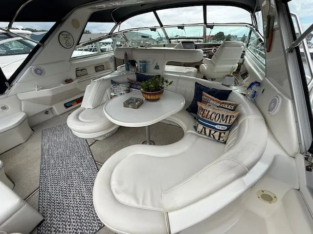 Slide: The Image of Interior of a 1998 Sea Ray 500 Sundancer yacht with white leather seating. - 16