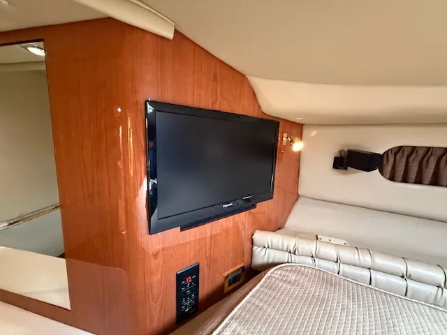 Slide: The Image of Interior of 1998 Sea Ray 500 Sundancer with TV and bed. - 22