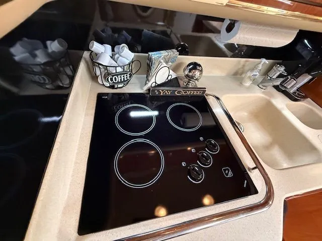 Slide: The Image of Kitchen area on a 1998 Sea Ray 500 Sundancer yacht. - 24