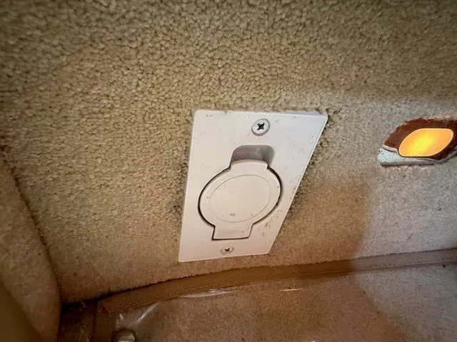 Slide: The Image of Interior of a 1998 Sea Ray 500 Sundancer with outlet. - 39